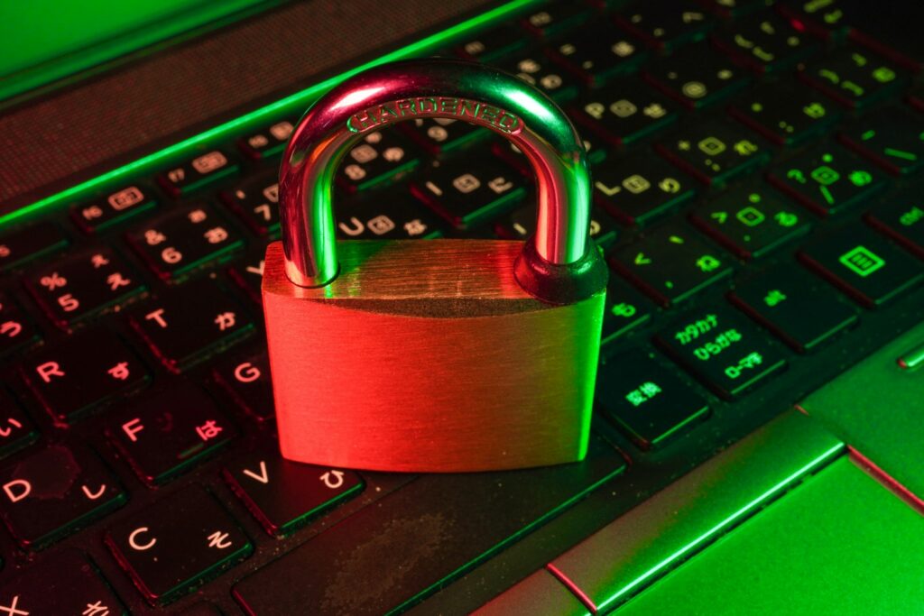 Red padlock on a keyboard – credit monitoring and fraud protection